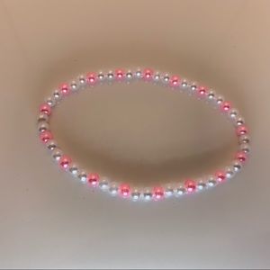 Pink and white beaded bracelets